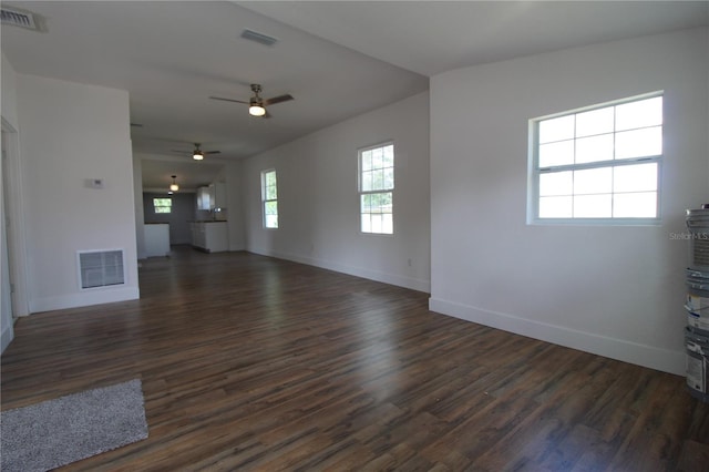 unfurnished living room with ceiling fan, lofted ceiling, and dark hardwood / wood-style flooring