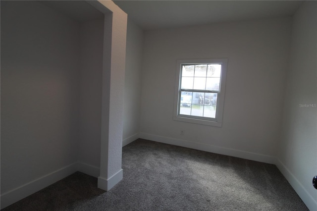 828 Willie Mays Pkwy, Orlando, FL 32811 - spare room with baseboards and dark carpet