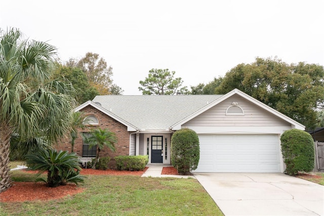 single story home featuring a front yard and a garage