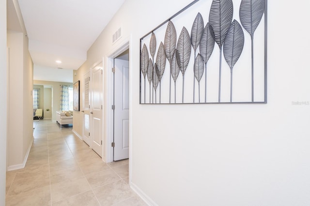 hallway featuring light tile patterned floors