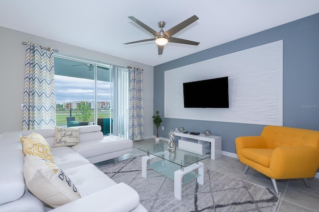 tiled living room with ceiling fan