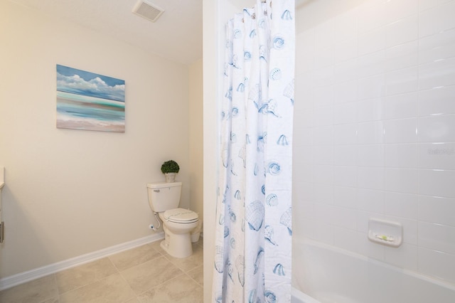 bathroom with shower / bath combo with shower curtain, toilet, and tile patterned flooring