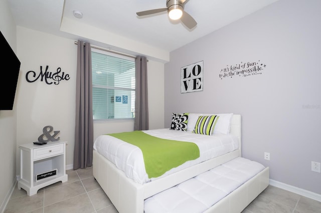 bedroom featuring light tile patterned floors and ceiling fan