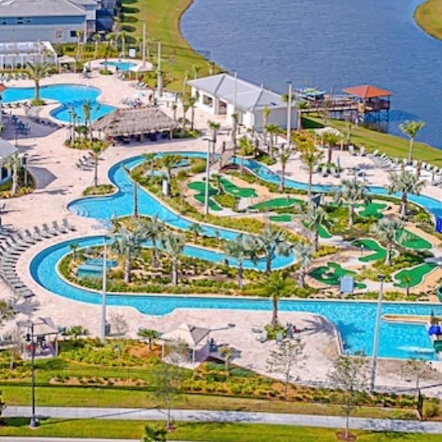 birds eye view of property featuring a water view