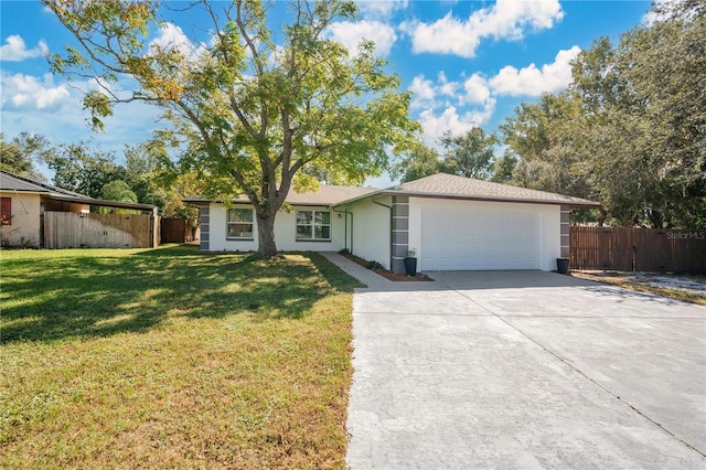 single story home featuring a front lawn and a garage