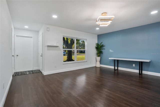 spare room featuring dark hardwood / wood-style floors