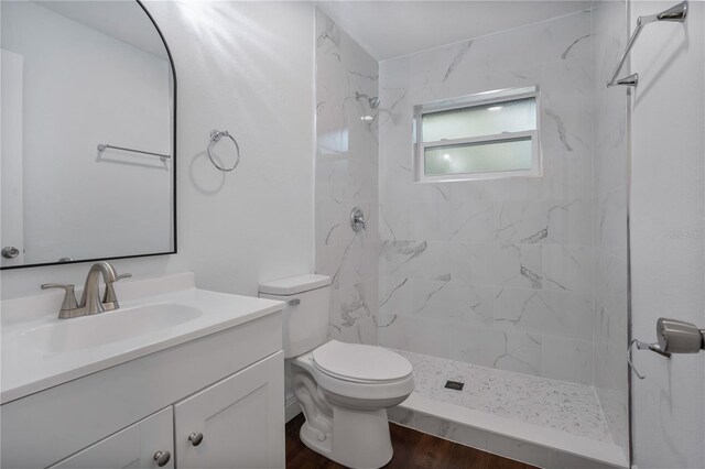 1213 Baranova Rd, Ocoee, FL 34761 - full bathroom with vanity, toilet, a marble finish shower, and wood finished floors