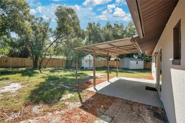 view of yard featuring a patio area and a shed