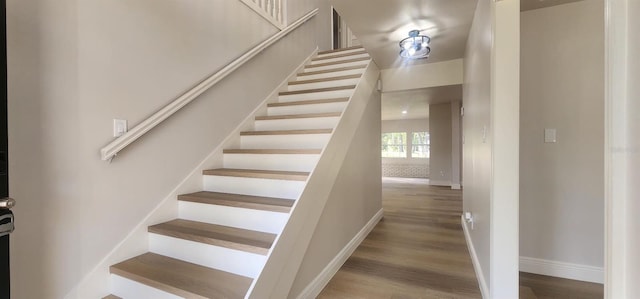 stairway featuring hardwood / wood-style flooring