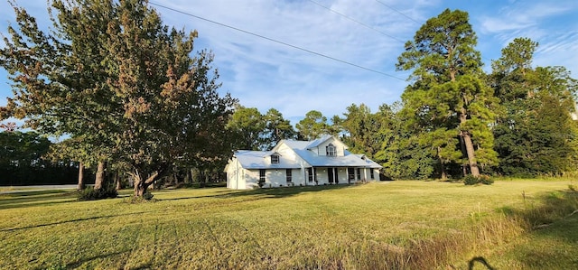 view of front of house featuring a front yard and a porch