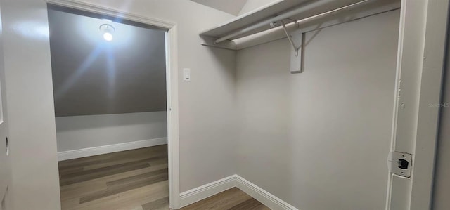 walk in closet featuring hardwood / wood-style floors