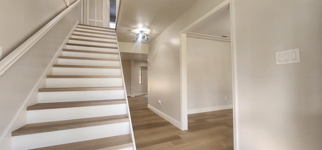 stairway featuring hardwood / wood-style flooring