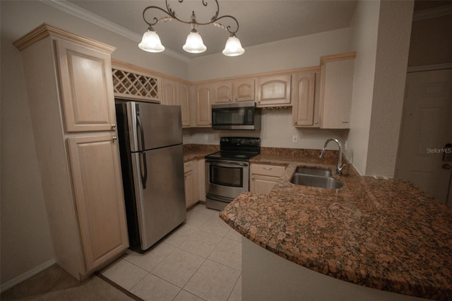 kitchen featuring sink, kitchen peninsula, appliances with stainless steel finishes, ornamental molding, and decorative light fixtures