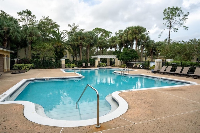 view of swimming pool with a patio