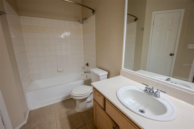 full bathroom featuring toilet, vanity, tile patterned flooring, and tiled shower / bath combo