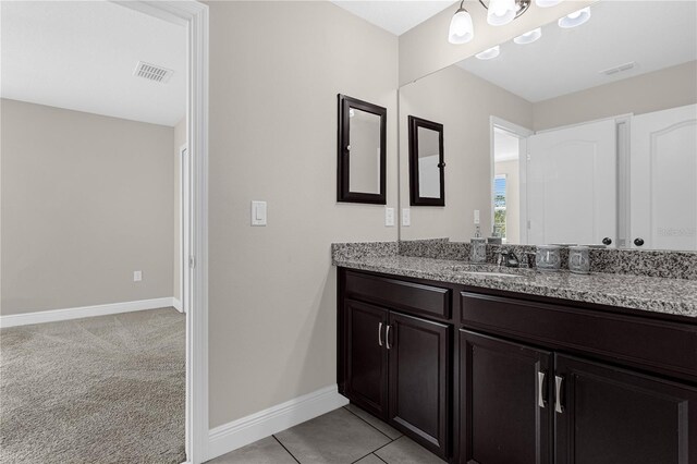 bathroom with vanity and tile patterned flooring