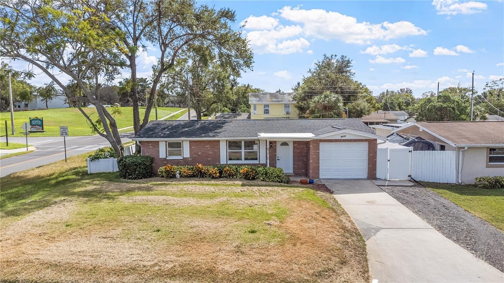 ranch-style house with a front lawn and a garage