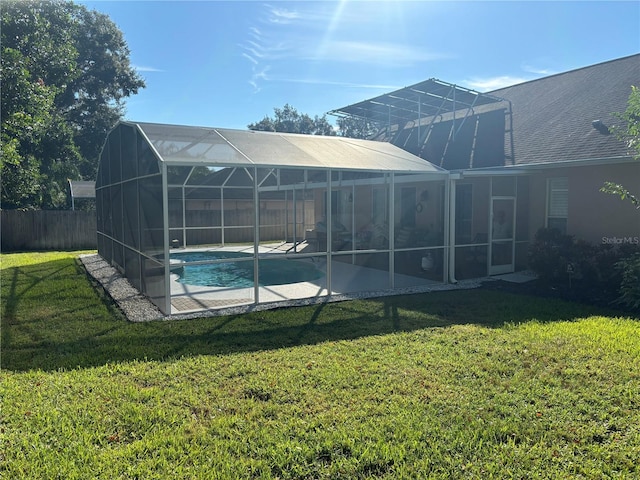 exterior space featuring a patio and glass enclosure