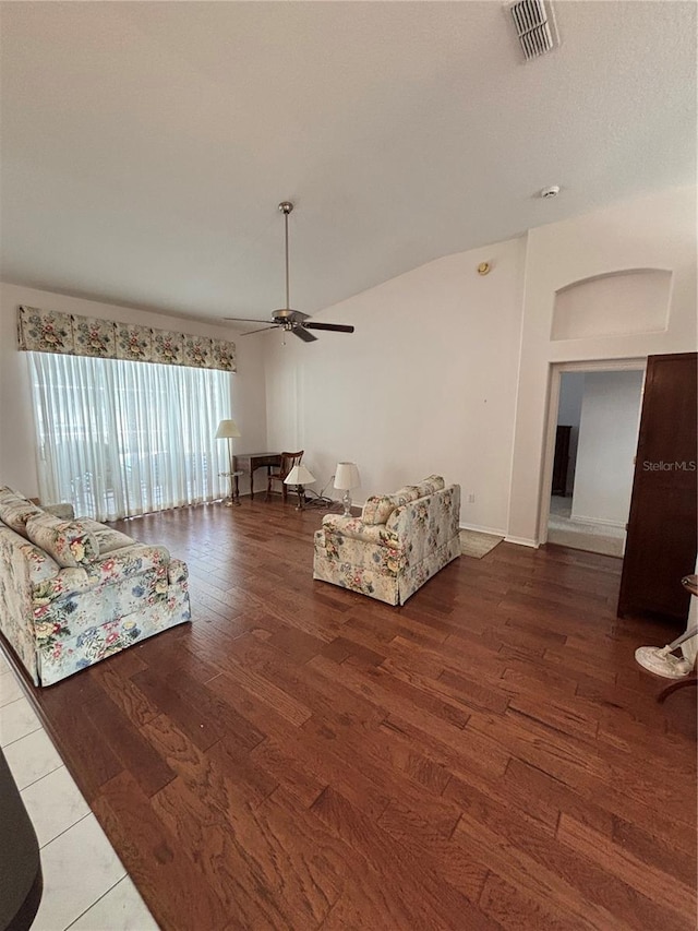 unfurnished living room featuring ceiling fan and wood-type flooring