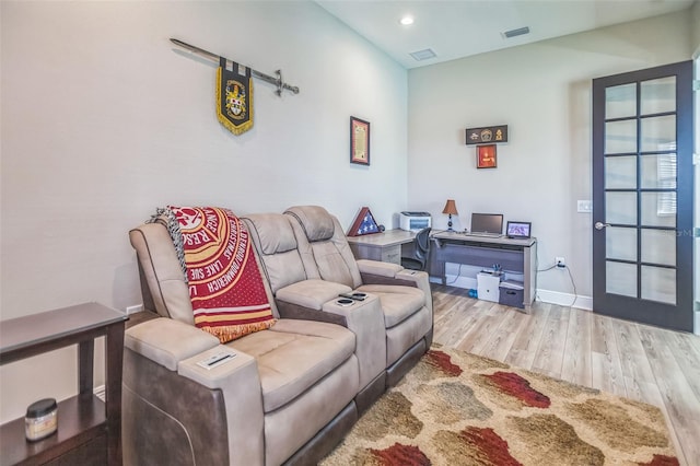 living room with light hardwood / wood-style flooring