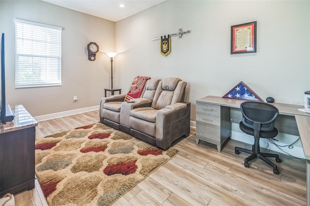 office with light hardwood / wood-style floors