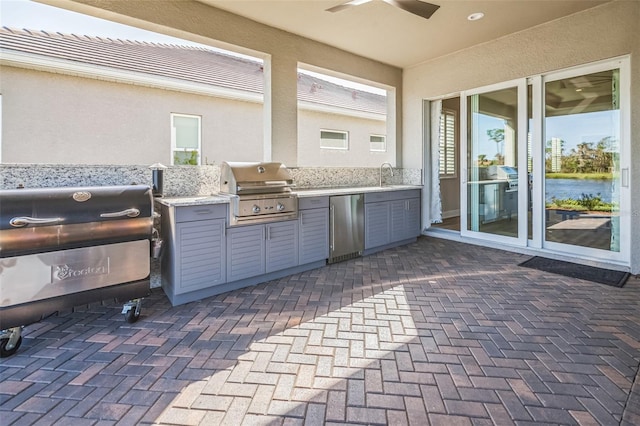 view of patio / terrace with area for grilling and french doors