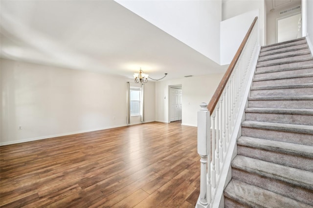 interior space with a notable chandelier and hardwood / wood-style floors