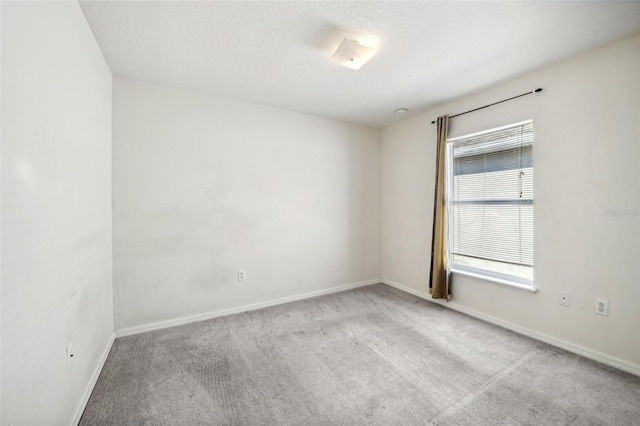 empty room with light colored carpet