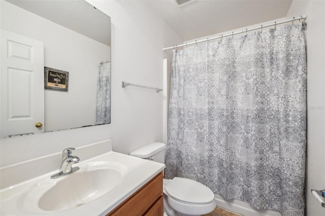 bathroom with vanity, toilet, a textured ceiling, and a shower with curtain