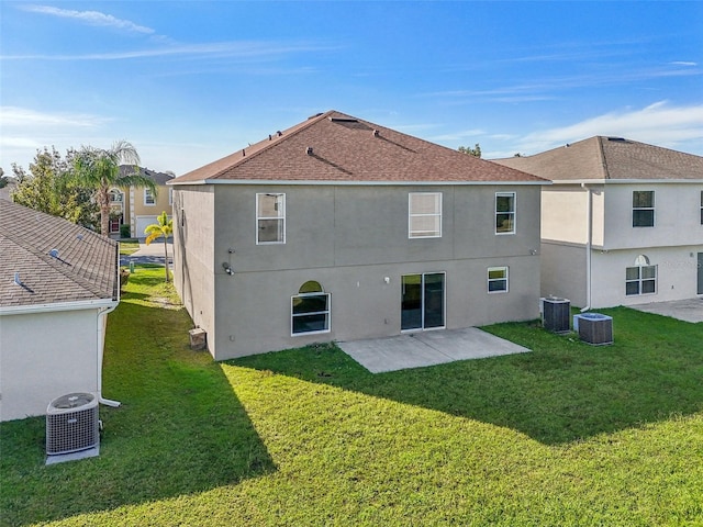 back of property featuring a patio, central AC, and a yard