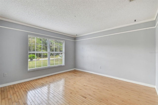 unfurnished room featuring wood-type flooring, a textured ceiling, and ornamental molding