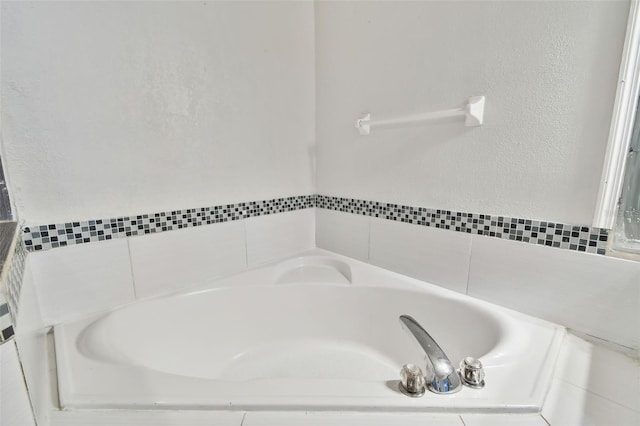 bathroom featuring a relaxing tiled tub