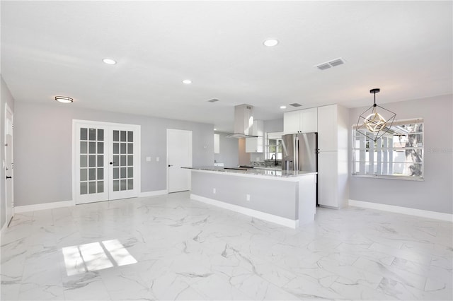 kitchen featuring hanging light fixtures, white cabinetry, range hood, an inviting chandelier, and stainless steel refrigerator with ice dispenser