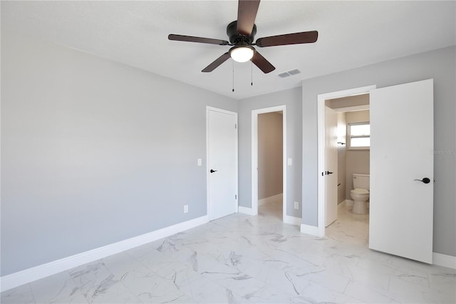 unfurnished bedroom featuring ceiling fan, a textured ceiling, and ensuite bathroom