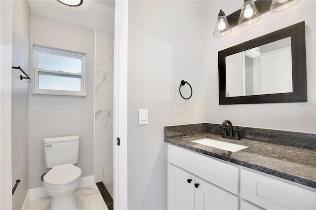 bathroom featuring vanity, a textured ceiling, and toilet