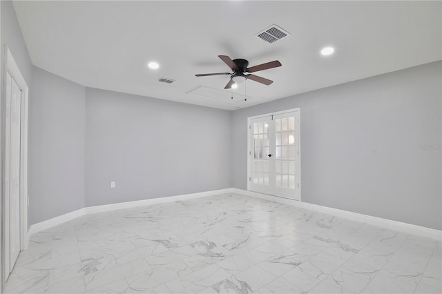 empty room with french doors and ceiling fan