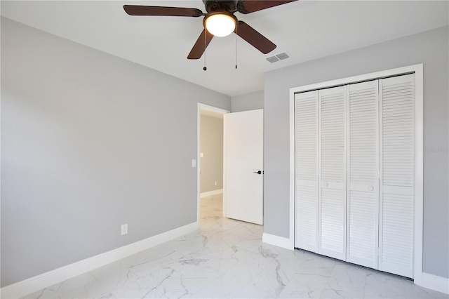 unfurnished bedroom featuring a closet and ceiling fan