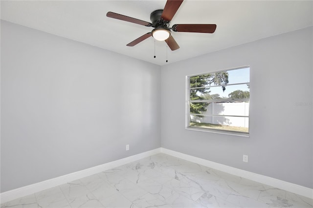 spare room with ceiling fan