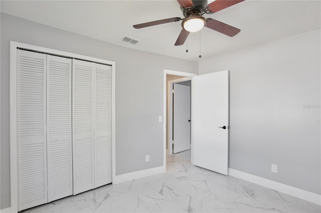 unfurnished bedroom featuring a closet and ceiling fan