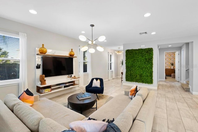 living room featuring a notable chandelier