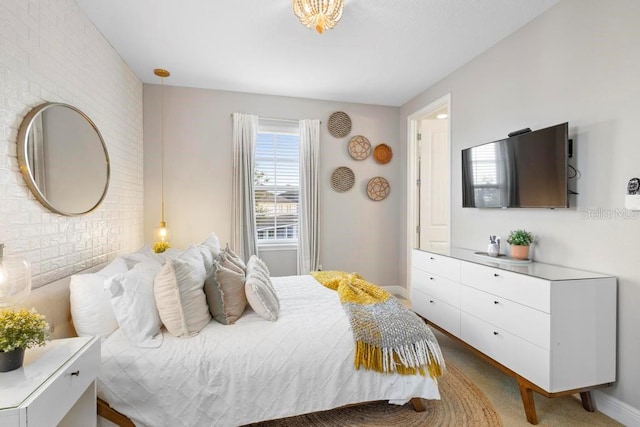 bedroom with brick wall