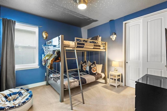 carpeted bedroom featuring a closet