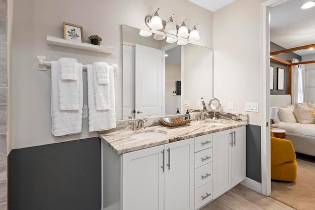 bathroom featuring vanity and hardwood / wood-style floors