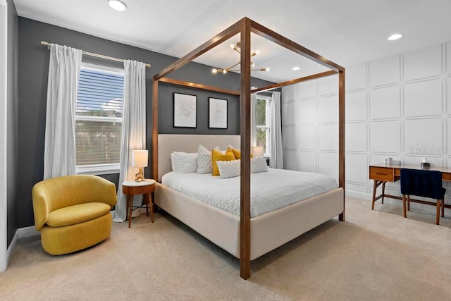 bedroom featuring carpet flooring and multiple windows