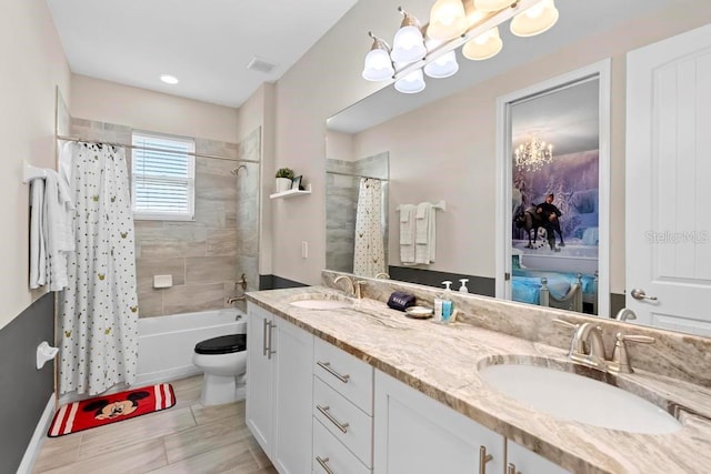 full bathroom featuring vanity, toilet, and shower / bath combination with curtain