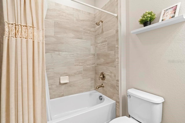 bathroom featuring toilet and shower / bathtub combination with curtain