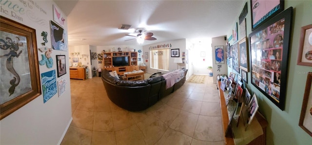 living room featuring tile patterned floors and ceiling fan