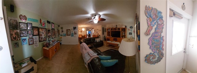 tiled living room featuring ceiling fan