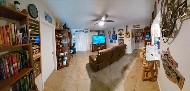 tiled living room with a textured ceiling and ceiling fan