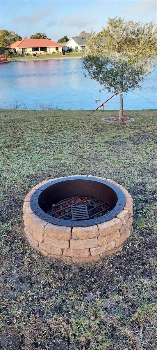 906 Bluewater Dr, Sun City Center, FL 33573 - exterior view of a fire pit